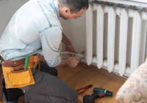 plumber fixing a radiator