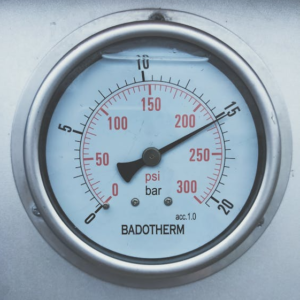 A boiler pressure gauge, showing bar and psi.