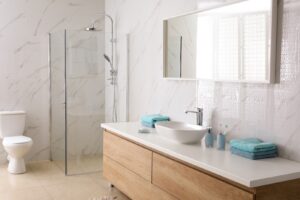 A pristine, newly remodelled bathroom with a light and spacious ambience.